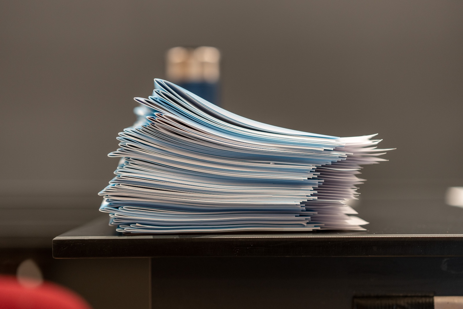 A stack of test blue books. Photo credit David Degner