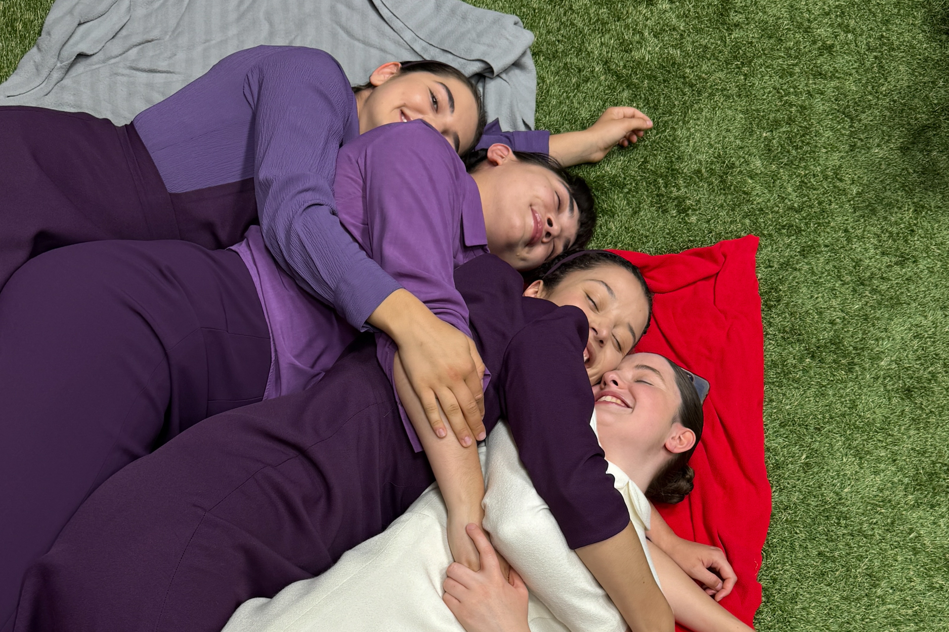 Co-stars Mattea Conforti, Rowan Blanchard, Chase Infiniti, and Lucy Halliday huddled together on a blanket
