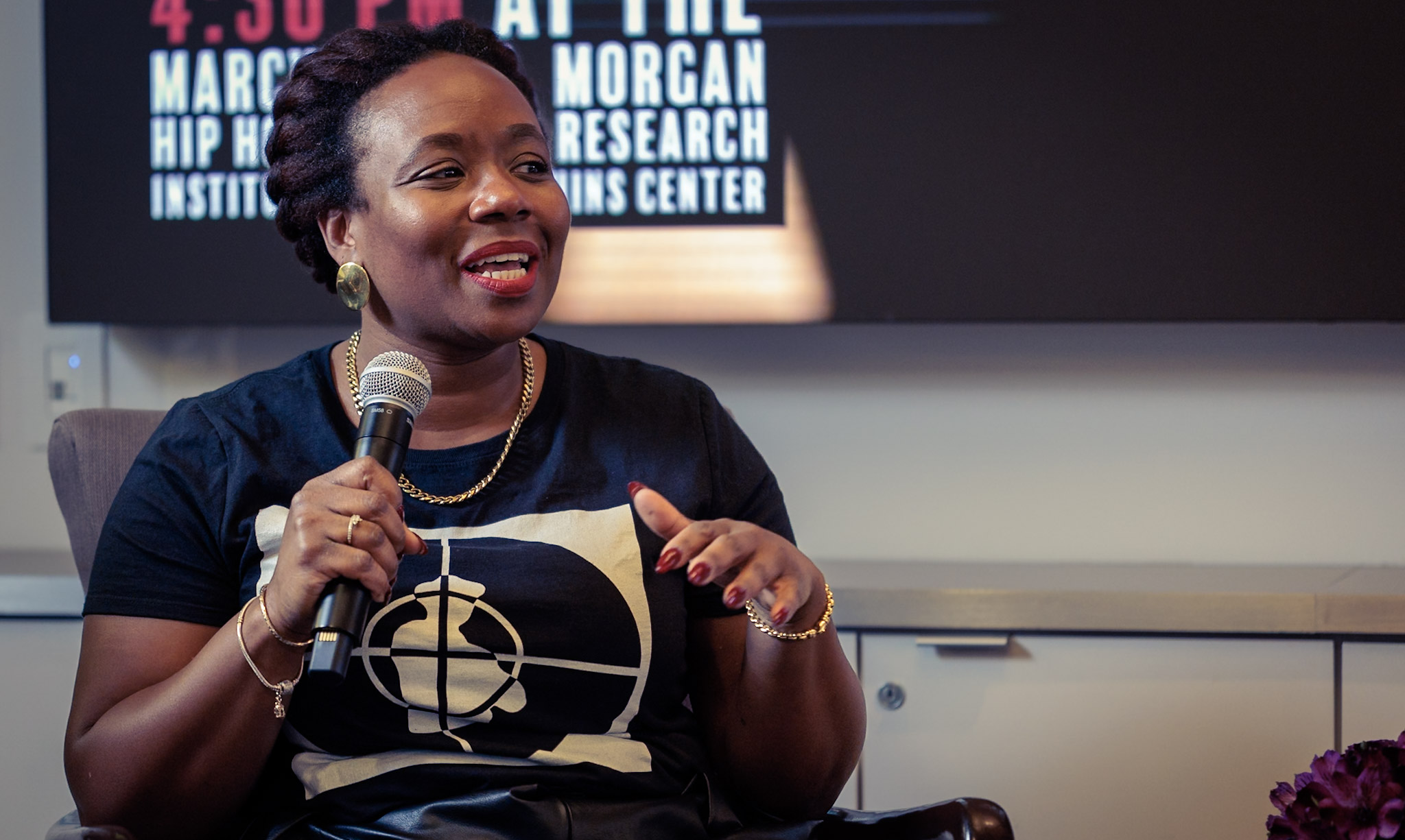 Alta Mauro, Associate Dean of Culture & Community, is seen speaking during an event with Flavor Flav at Harvard University’s Marcyliena H. Morgan Hip Hop Archive & Research Institute.