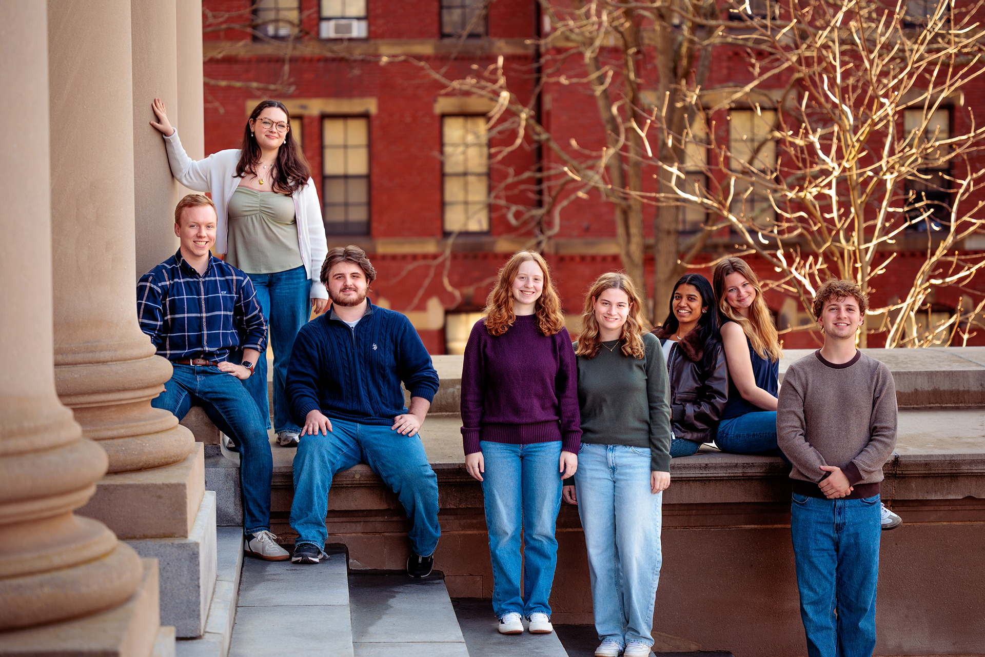 A group of students posing on the steps of Widener Library