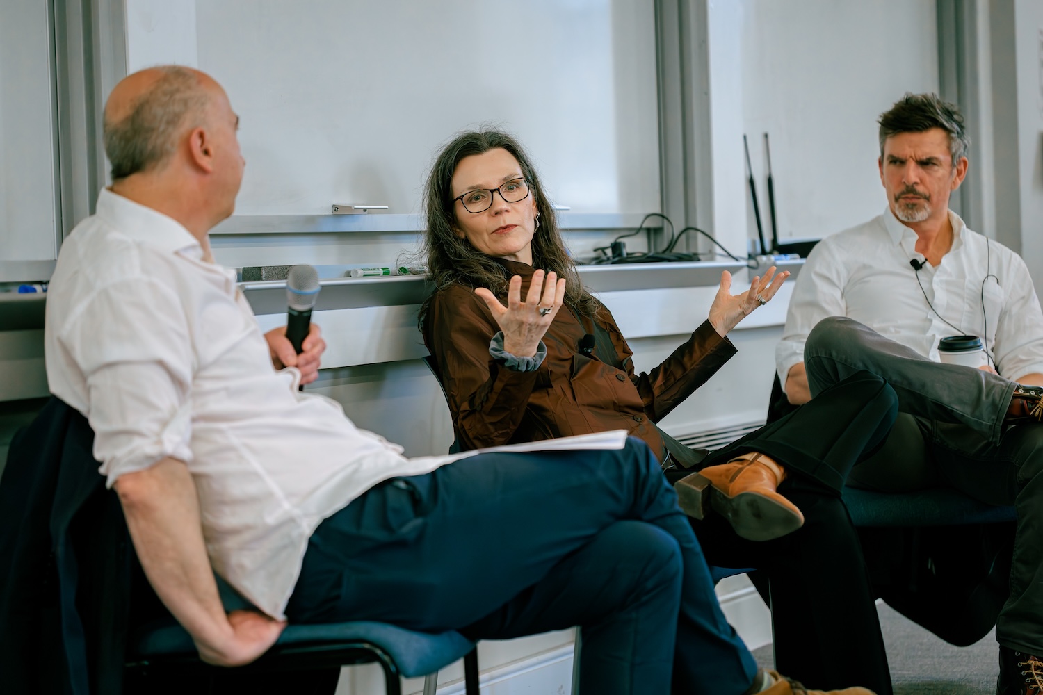 From left, Harvard University Professor of the Practice James Wood, Tufts University's Hilary Binda, and Atlantic columnist James Parker appear at the front of a classroom.