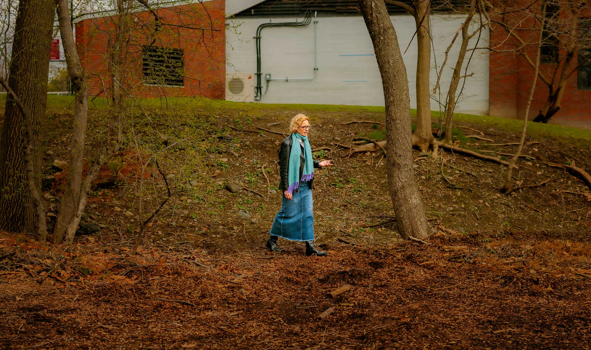 Joyce Chaplin walking the site of the spring 2026 “Rewilding Harvard” project outisde the Center for Astrophysics