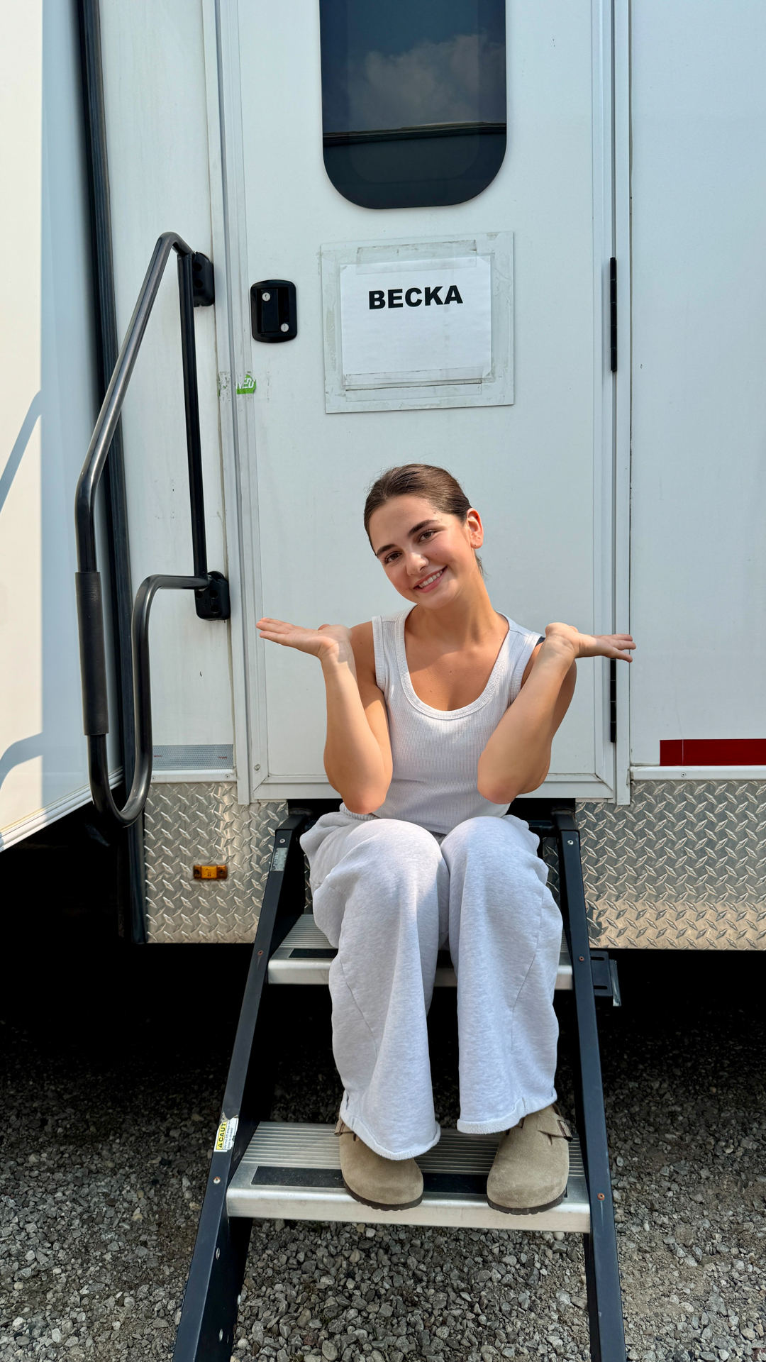 Mattea Conforti sitting outside her trailer on set