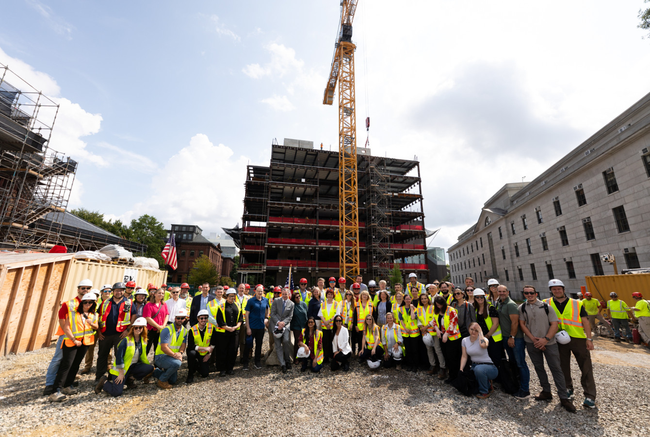 A group of people in fluorescent vests at a construction site