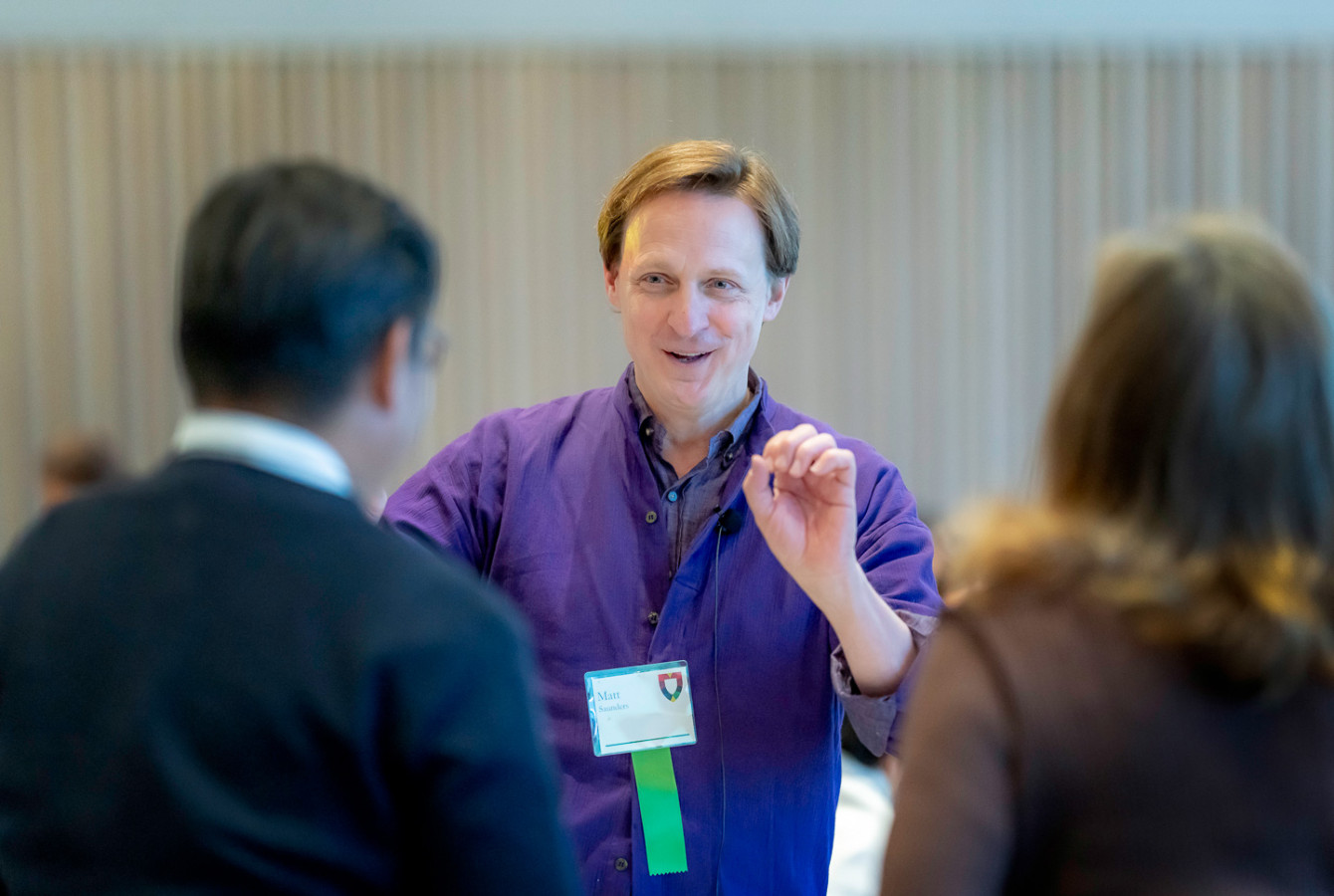 Professor Matt Saunders speaks to Volunteer Assembly attendees