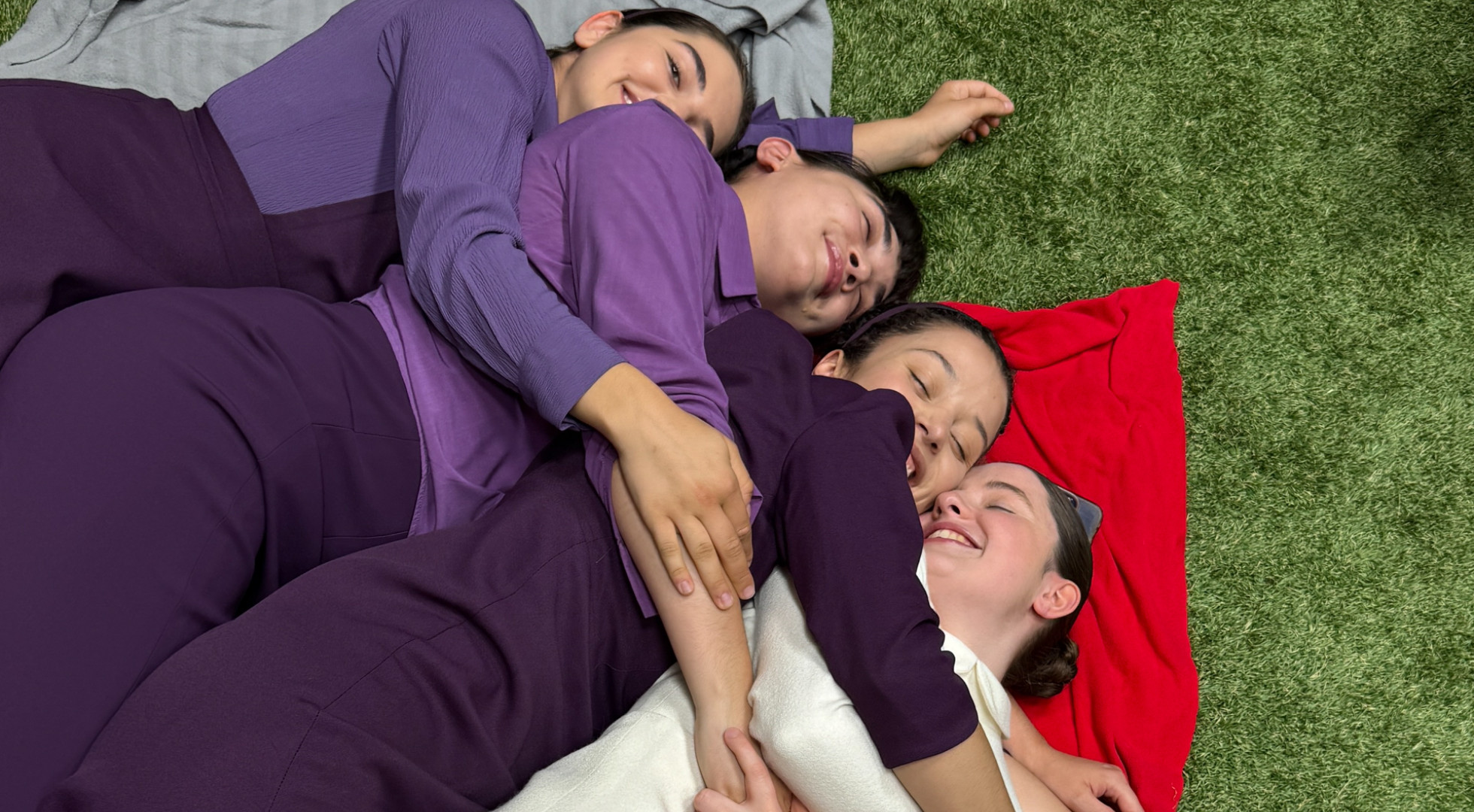 Co-stars Mattea Conforti, Rowan Blanchard, Chase Infiniti, and Lucy Halliday huddled together on a blanket