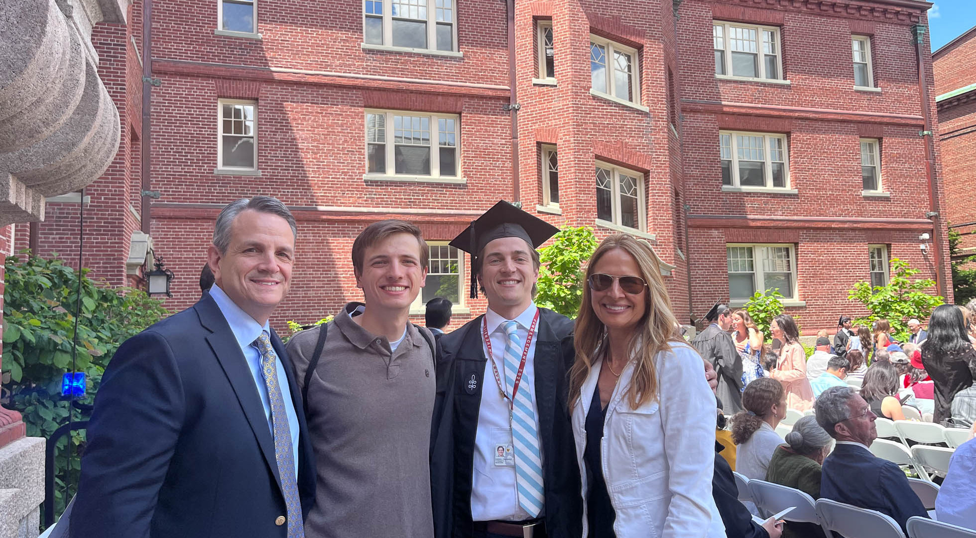 Harvard College graduate Joseph Periello with family members before the 2026 diploma ceremony at Adams House