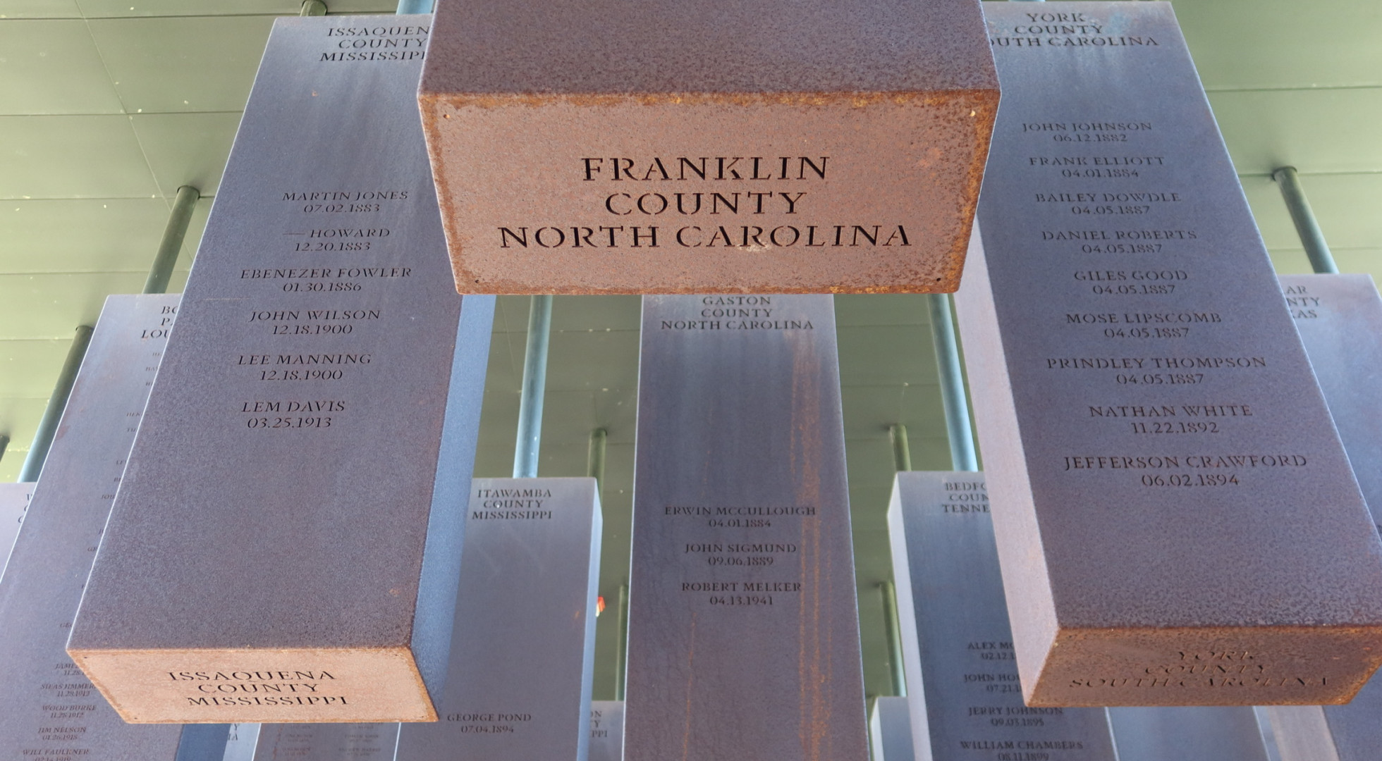 A close-up of names inscribed at the National Memorial to Peace and Justice in Montgomery, Ala.