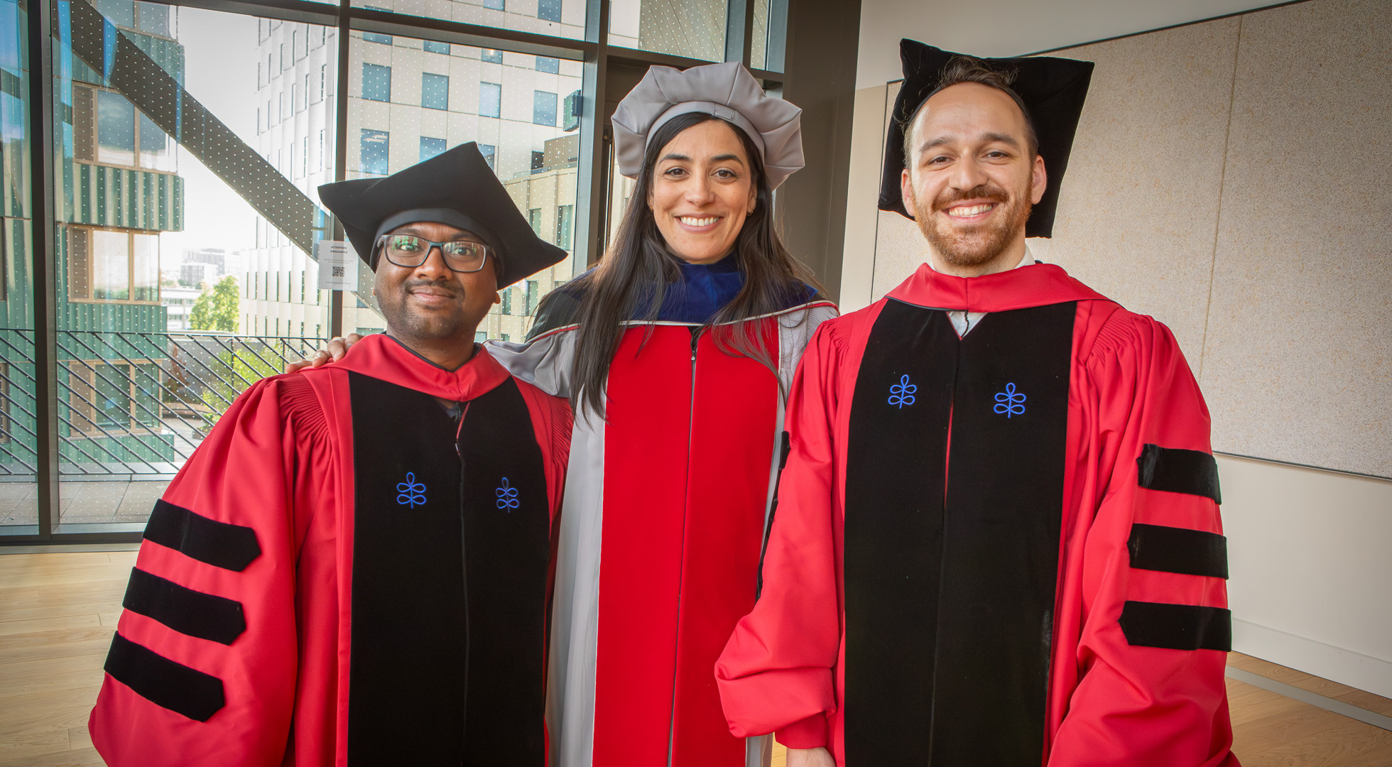 Engineering Professor Stephanie Gil posed with Ph.D. students Ninad Jadhav and Orhan Eren Akgün on Harvard University's Commencement Day.