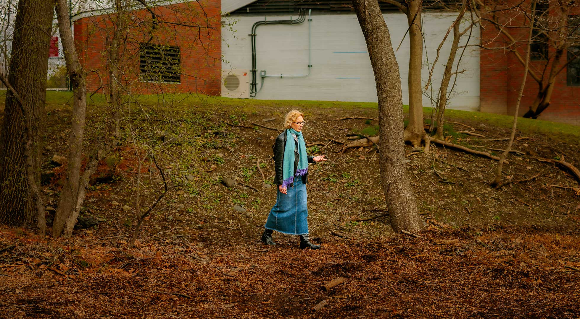 Joyce Chaplin walking the site of the spring 2026 “Rewilding Harvard” project outisde the Center for Astrophysics