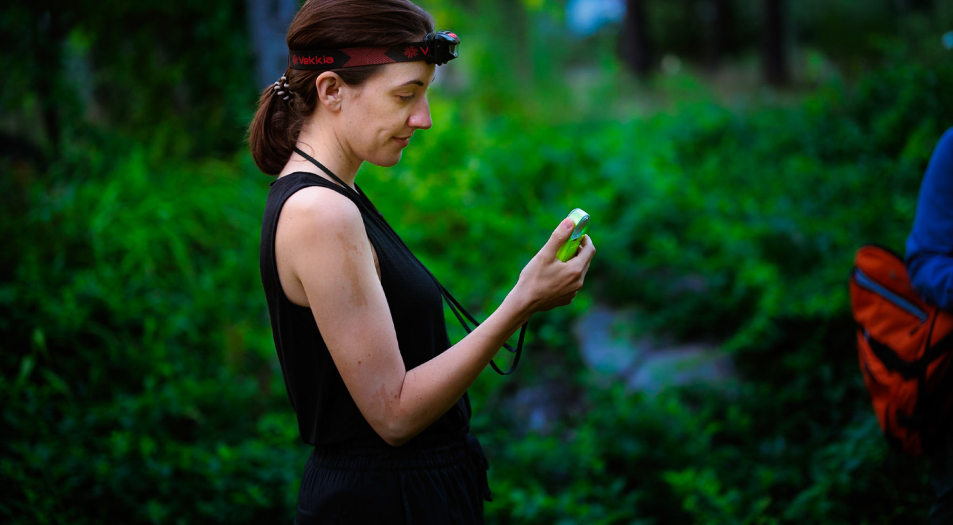 Researcher Avalon Owens in the field with a stopwatch