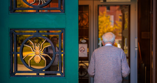 From the back, Rich Losick entering the Bio Labs through the front doors