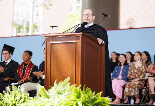 Harvard President Alan Garber at a podium