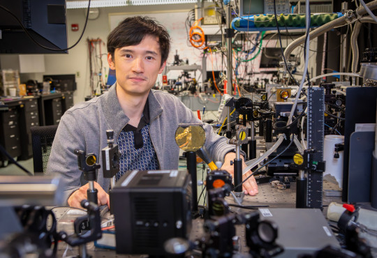 Arman Amirzhan, Ph.D. ’26, in the lab