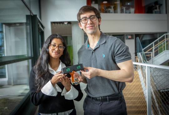 Daniel Kocot ’26 and Elsa Oreen ’26 holding their pair of smart glasses
