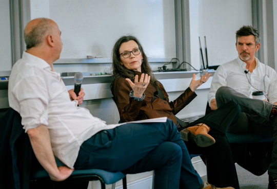 From left, Harvard University Professor of the Practice James Wood, Tufts University's Hilary Binda, and Atlantic columnist James Parker appear at the front of a classroom.