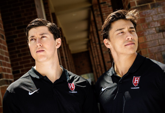 A close-up portrait of Harvard students and lacrosse midfielders Owen Guest, at left, and Francisco Cortes