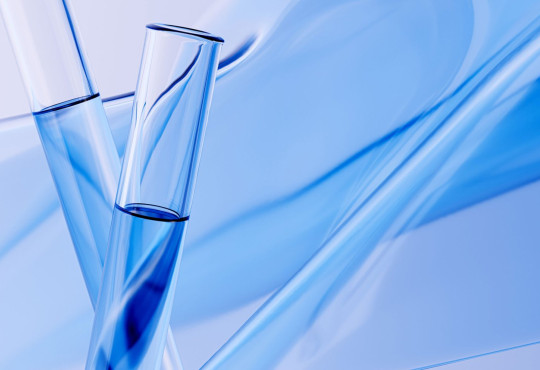 Two test tubes filled with blue-tinted liquird