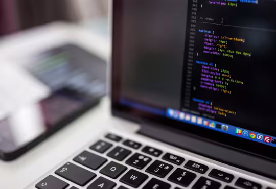 View of a laptop with coding terminal on screen