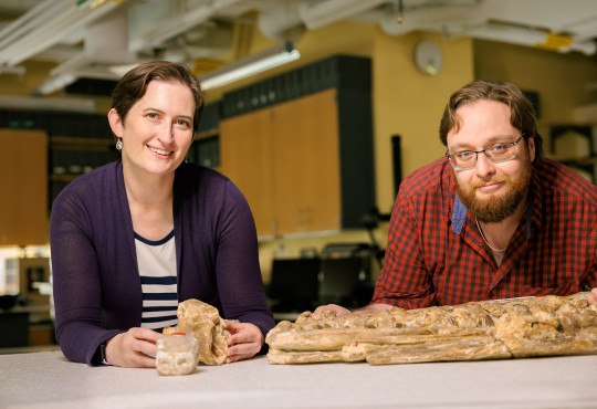 Museum of Comparative Zoology collections manager Christina Byrd, at left, and MCZ fossil preparator Scott Johnston pose with a Tylosaurus proriger fossil jaw.
