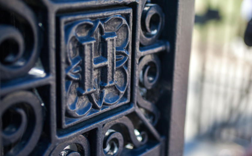 Close-up of Bradstreet Gate featuring a wrought-iron H