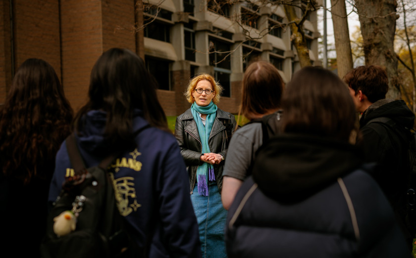 Joyce Chaplin speaking with students outside the Center for Astrophysics at Harvard University