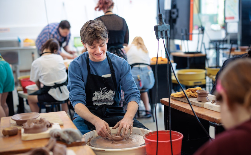Harvard first-year Beau Chiasson at a pottery wheel