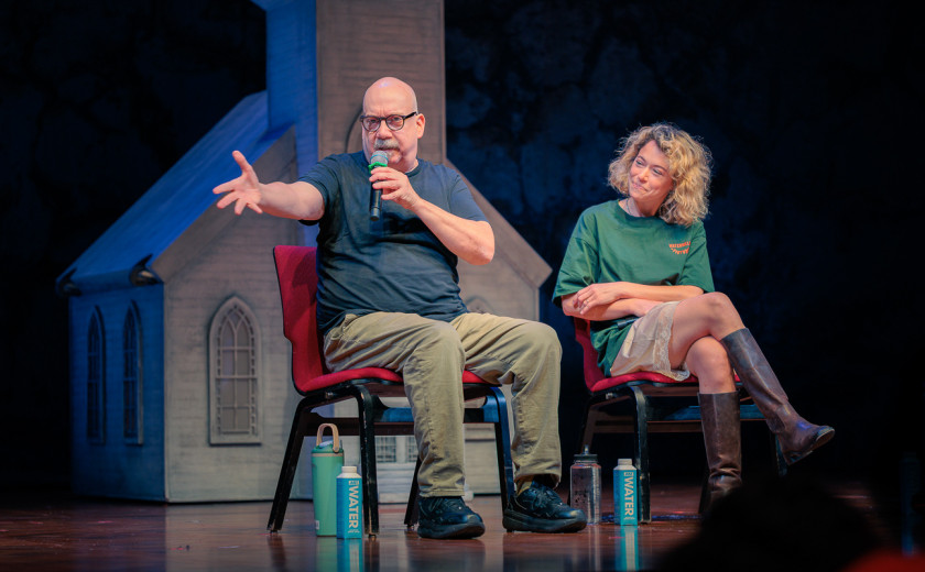Paul Giamatti and Tatiana Maslany seated on stage at the Loeb Drama Center in a Q&A session