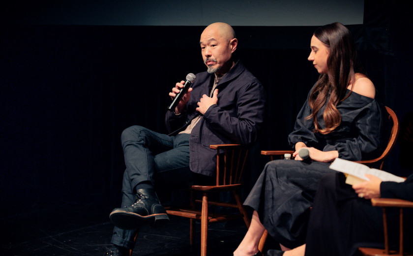 Hoon Lee ’94 speaking on stage about Asian American representation during a discussion at Harvard