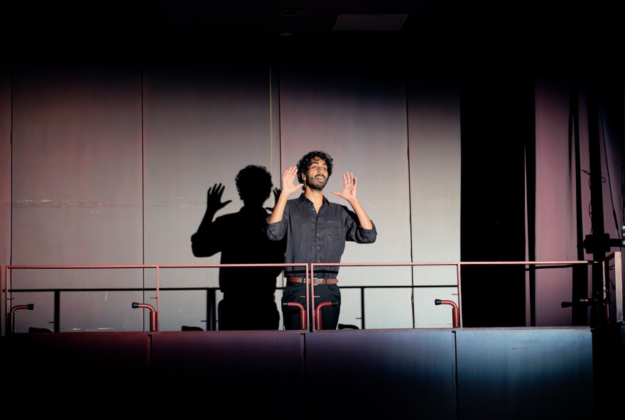 Harvard College student Saman de Silva sang stands on a balcony singing "Oh, What a Beautiful Mornin'" from the musical “Oklahoma!”