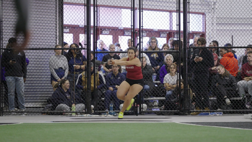 Alice Mihas throwing a weight in competition