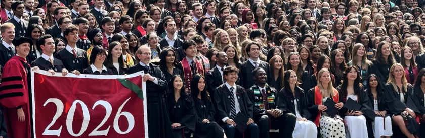 A group photo of the Harvard College graduating class in academic regalia