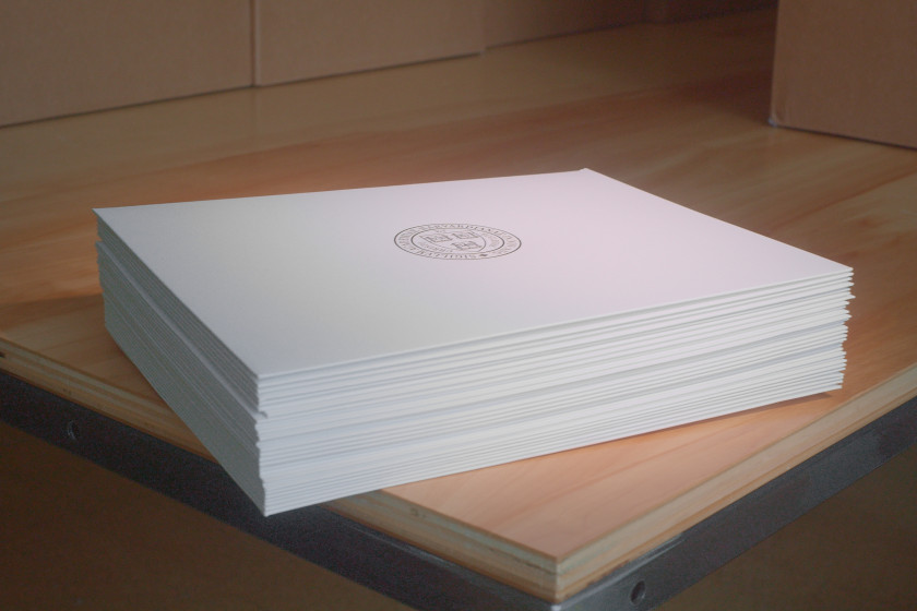 A stack of Harvard diplomas